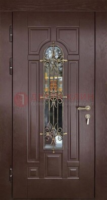 Темная железная дверь со стеклом и ковкой для частного дома ДСК-156 в Талдоме